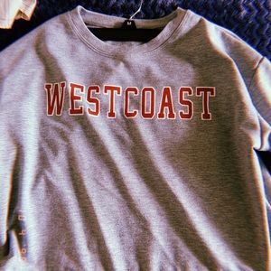 Grey cropped sweatshirt.